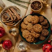 A selection of cookies on a festively decorated table. Credit: Canva