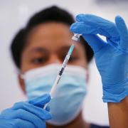 A medical professional preparing a vaccine. Credit: PA