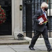 Prime Minister Boris Johnson leaves 10 Downing Street, London, to attend Prime Minister's Questions at the Houses of Parliament. Picture date: Wednesday December 15, 2021. Credit: PA