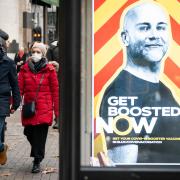 Photo via PA shows the Government's Get Boosted Now campaign rolled out across the nation's highstreets.