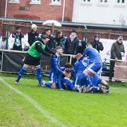 Brockenhurst's celebrations in the fourth-round win over local rivals New Milton (Pic: Steve Ross / @ThoseWhiteLines)