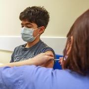 Xavier Aquilina, aged 11, has a Covid-19 vaccination at the Emberbrook Community Centre for Health, in Thames Ditton, Surrey. Photo via PA.