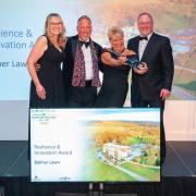 Hotel co-owners, Chris and Alison Wilson collecting their award at The Beautiful South Awards for Excellence 2022. Picture: Balmer Lawn Hotel & Spa