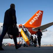 People boarding an easyjet flight. Credit: PA