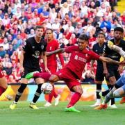 Liverpool's Roberto Firmino (centre) scores their side's seventh goal of the game during the Premier League match at Anfield, Liverpool. Pic: Jack Tanner