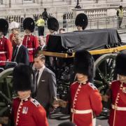 The black coffin was pulled by the King's Troop Royal Horse Artillery early this morning (PA)