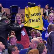 Liz Truss was heckled by protestors at the Conservative Party conference (PA)