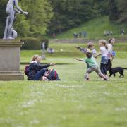 Picture of visitors and their dog at Studley Royal Water Garden. See PA Feature GARDENING Dog. Picture credit should read: Chris Lacey/National Trust Images/PA. WARNING: This picture must only be used to accompany PA Feature GARDENING Dog.