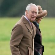 The King smiled and waved to the public as he arrived for the church service today