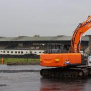 Contractors with excavators have begun clearing the concrete seating terraces at GAA stadium in Belfast, Northern Ireland, ahead of the long-delayed redevelopment of the stadium (PA)