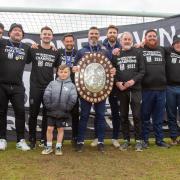 Tim Sills with his coaching staff after winning the title with Wimborne