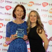 Photograph shows Veronica Ryder, left, receiving her award from Charlotte Smith from PPL