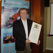 Dave Corben receiving his record of service certificate in 2020.