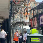 Bus crashes with scaffolding in town centre