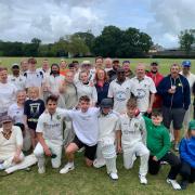 The teams at the Cllr Charles Baker memorial cricket match.