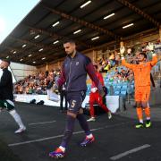 England's Taylor Harwood-Bellis leads out the team before the UEFA Euro U21 Championship Qualifying match at the Ballymena Showgrounds, County Antrim. Picture date: Friday September 6, 2024.