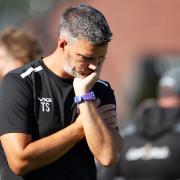 Wimborne Manager Tim Sills contemplating the score line. Wimborne Town 0-2 Weston Super Mare Played at Wyatt Home Stadium, Wimborne Saturday 14September 2024.  Photo by Steve Harris