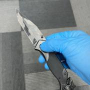 During the day of action, a quantity of alcohol and a locking knife were seized by officers.