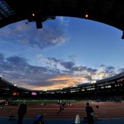 A general view of the sun setting as the athletics takes place at Hampden Park during the 2014 Games (John Giles/PA)