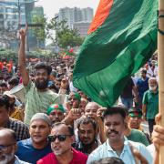 Protesters demand a democratic transition through an election in Dhaka (Rajib Dhar/AP)