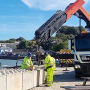 The team from the Environment Agency installing the wave barriers on Lower High Street 17 September