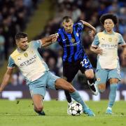 Manchester City’s Rodri and Inter Milan’s Henrikh Mkhitaryan (right) battle for the ball (Nick Potts/PA)