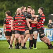 Players celebrate with MOTM Grant Hancox after winning  the match between Bournemouth and Winchester in dramatic style played at Chapel Gate, Bournemouth on Saturday 12 October 2024.  Photo taken by Simon Carlton