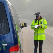 Police officers stop cars speeding in the New Forest