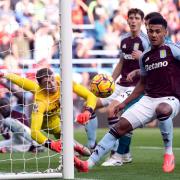 Bournemouth goalkeeper Mark Travers saves a header from Aston Villa's Amadou Onana