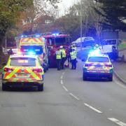 Road closed after car flips on its roof