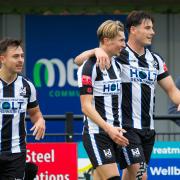 Goals from Matty Burrows (centre) and Jack Lovell weren't enough as Wimborne lost 3-2 to Marlow. File photo.