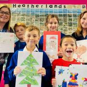 (From left to right) Jo Saunders, Marketing and Communications Manager at the DCCF, Heatherlands Primary School art ambassador Franklin, Year 3 competition winner Alex, Year 5 winner Grace, Year 1 winner Charlie and Sammy Bumford, DCCF Ambassador