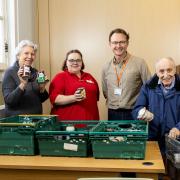 Residents Carol Brown and Ben Crofton with Canford Chase companionship team Leader Vicky Day and food bank project manager Ian Stoney