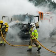 Firefighters extinguish a bin lorry fire in Somerford, Christchurch