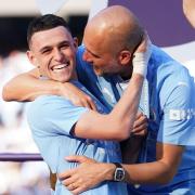 Pep Guardiola celebrating with Phil Foden (Martin Rickett/PA)