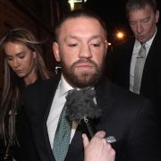 Conor McGregor and partner Dee Devlin leave the High Court in Dublin (Brian Lawless/PA)