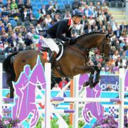 MEDAL TRIUMPH: William Fox-Pitt in action on Lionheart in this afternoon's showjumping round at Greenwich Park