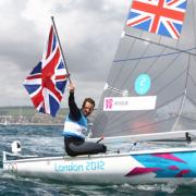 GOLDEN BOY: Ben Ainslie celebrates yesterday