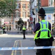 Police stood at the cordon following the shooting at Roumelia Lane last July