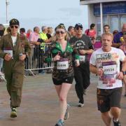 44-year-old Nick Hitchings - far left - ran the 5k, 10k, half marathon and full marathon