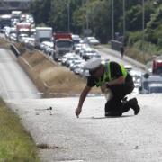 File image of a police officer at a crash