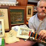 DISTINCTION: Lester Brown with some of his grandad’s memorabilia