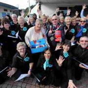 The Mayor of Bournemouth Cllr Chris Mayne joins Cllr Anne Rey and members of Voice choir to support of the annual Poppy Appeal