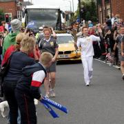 REALISING A DREAM: Nathan Bailey carried the Olympic torch through Boscombe ahead of London 2012. Now, he's heading to Rio.