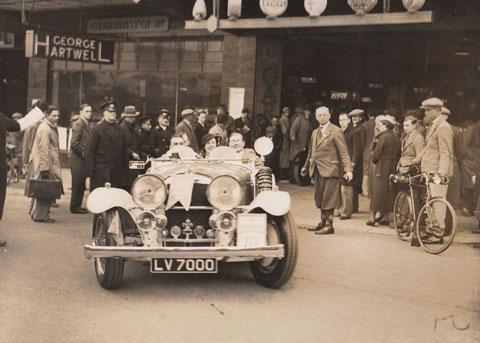 A caron the George Hartwell Rally pulls out of the Westover Road garage