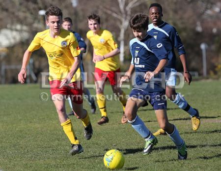 Football action Greenfields v Moordown U16's at King George V playing fields in Ferndown