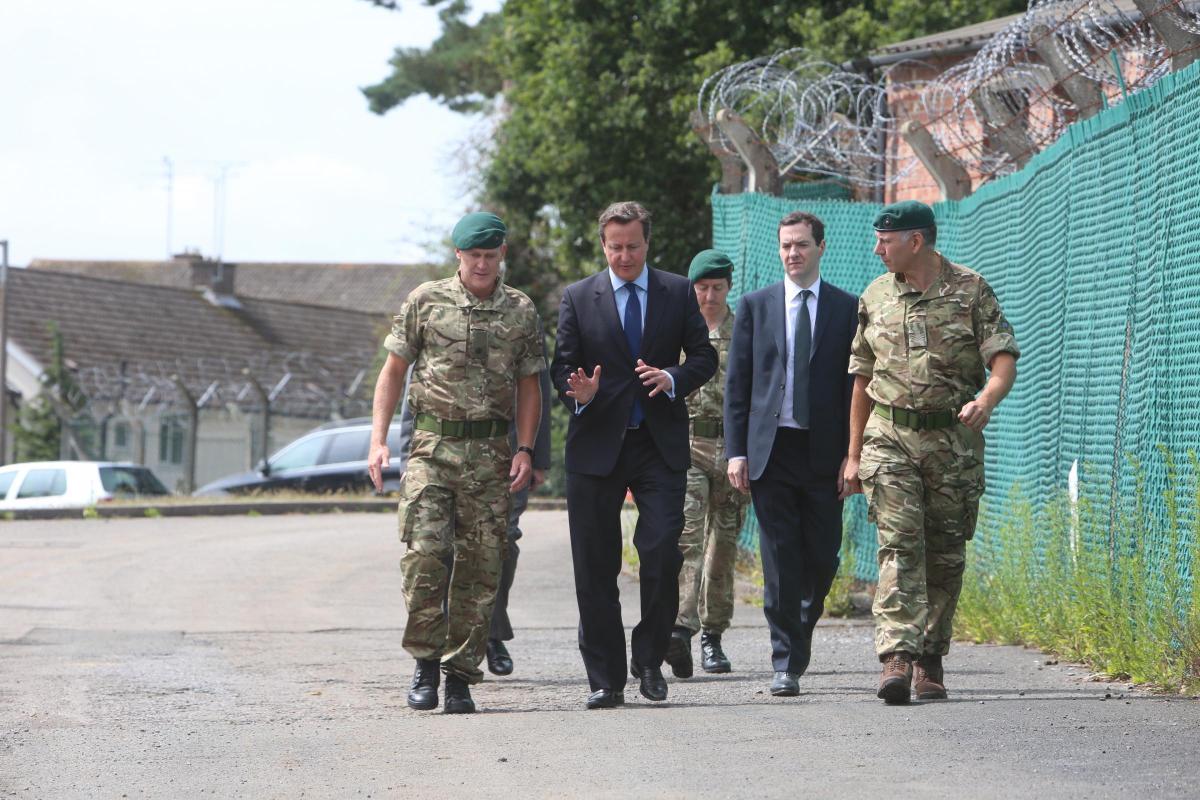 Prime Minister David Cameron and Chancellor George Osborne visit the Royal Marines base in Poole on Friday August 1, 2014