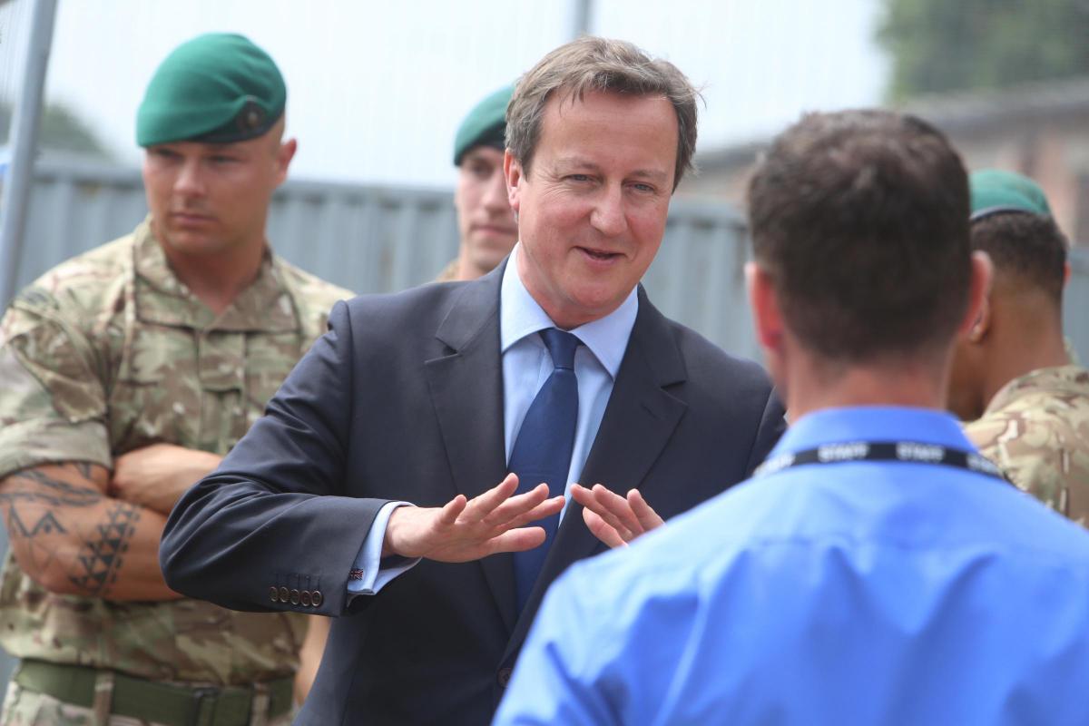 Prime Minister David Cameron and Chancellor George Osborne visit the Royal Marines base in Poole on Friday August 1, 2014