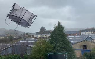 Handout photo taken with permission from the Twitter feed of @john_morgan_wal showing a trampoline flying mid air during Storm Eunice in Builth Wells, mid Wales. Via PA.