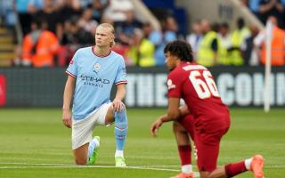 Manchester City's Erling Haaland and Liverpool's Trent Alexander-Arnold taking a knee before the FA Community Shield (PA)